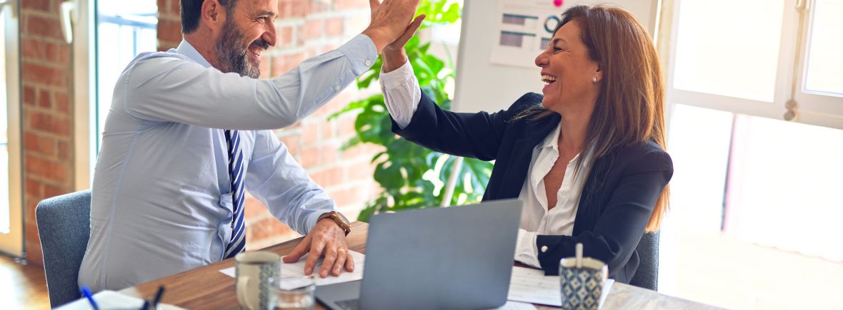 man and woman high five each other
